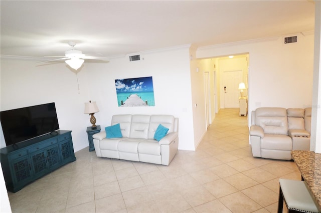 living room featuring a ceiling fan, visible vents, crown molding, and light tile patterned flooring