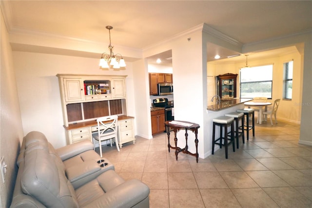 interior space with light tile patterned floors, a notable chandelier, and crown molding