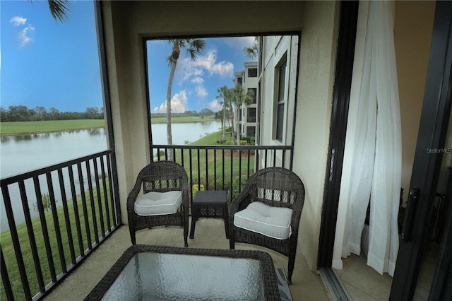 balcony featuring a water view