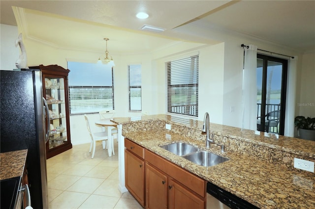 kitchen with ornamental molding, appliances with stainless steel finishes, and a sink