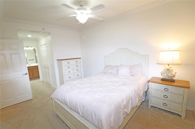 bedroom with a ceiling fan, light colored carpet, ensuite bath, crown molding, and a closet