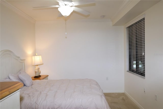 bedroom featuring light carpet, crown molding, baseboards, and ceiling fan