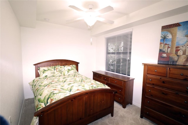 bedroom with ceiling fan and light colored carpet