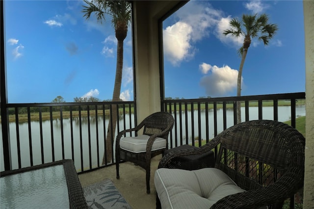 balcony featuring a water view