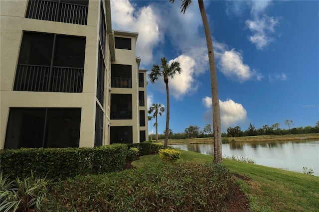 view of building exterior featuring a water view