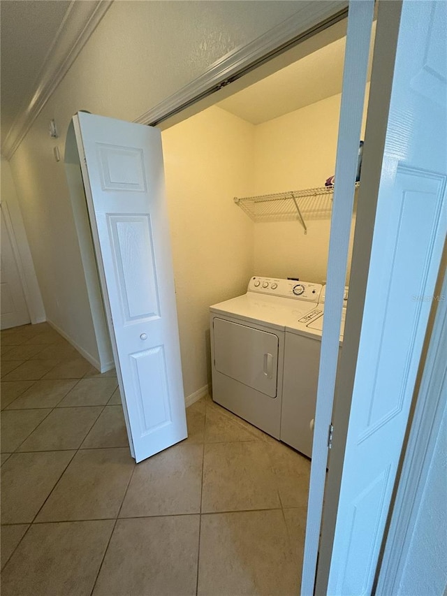 7005 River Hammock Dr Unit 207, Bradenton, FL 34212 - laundry room with independent washer and dryer and light tile patterned flooring