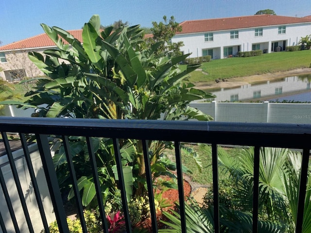 balcony featuring a water view