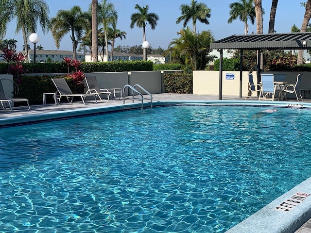 community pool with a patio area