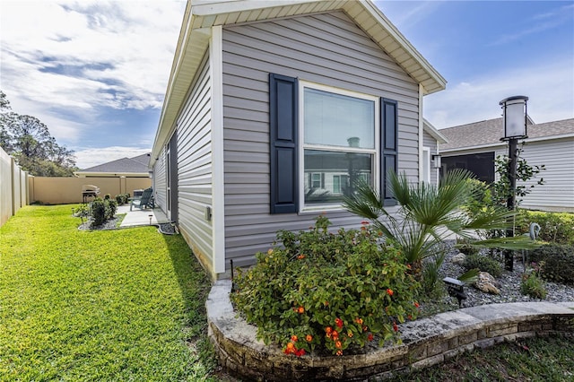 3390 Melissa Ln, The Villages, FL 32163 - view of home's exterior featuring a fenced backyard, a patio area, and a yard