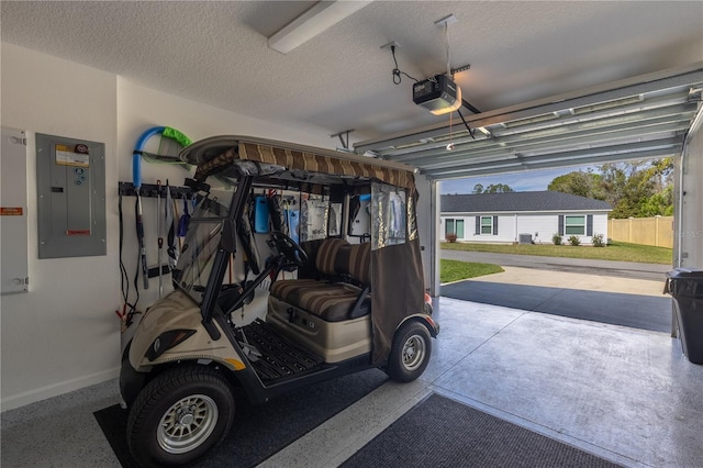 3390 Melissa Ln, The Villages, FL 32163 - garage featuring electric panel, a garage door opener, and baseboards