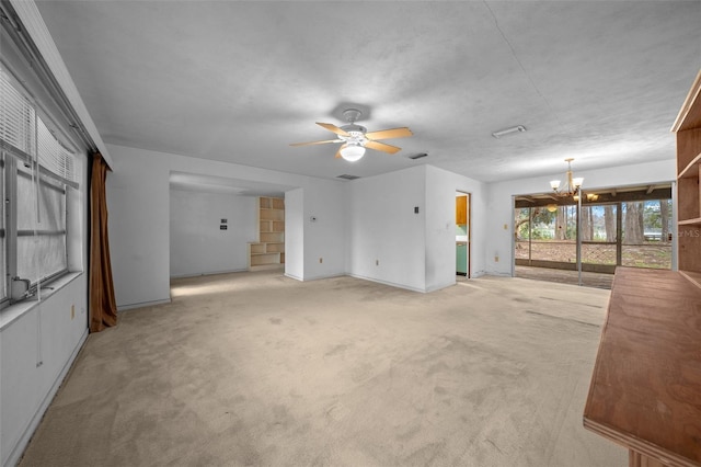 unfurnished living room with light colored carpet, baseboards, and ceiling fan with notable chandelier