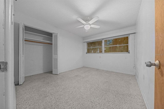 unfurnished bedroom with baseboards, a ceiling fan, light speckled floor, and a closet