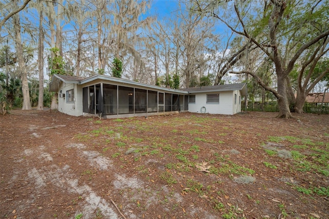 back of house with a sunroom