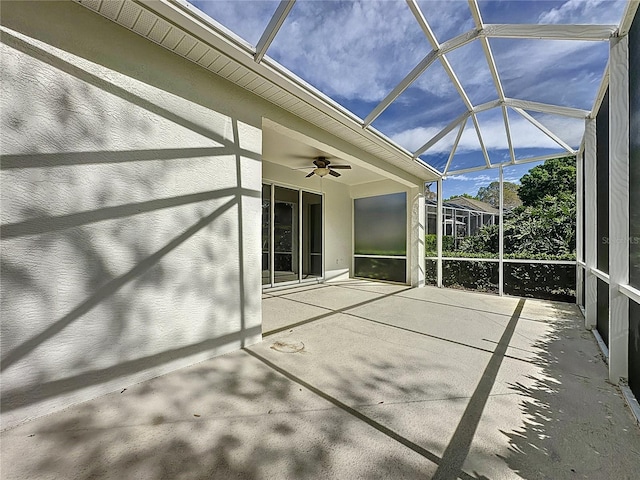 view of patio with a lanai and ceiling fan