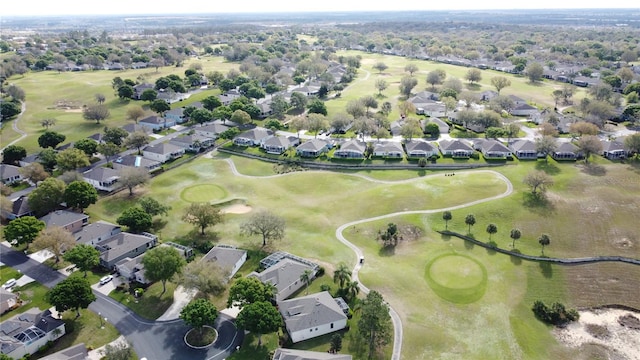 bird's eye view with view of golf course and a residential view