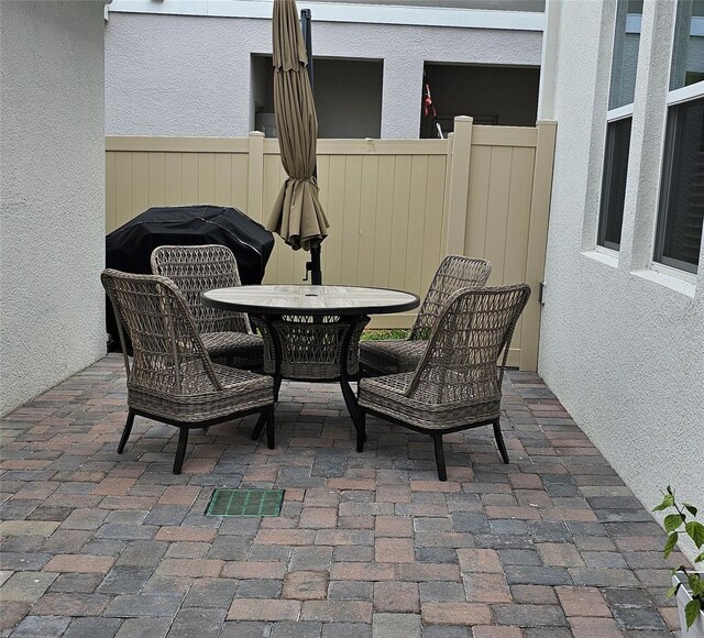 1723 Happiness Row, Kissimmee, FL 34744 - view of patio / terrace featuring fence and outdoor dining area
