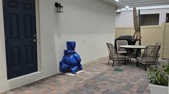 1723 Happiness Row, Kissimmee, FL 34744 - view of patio featuring outdoor dining area and fence