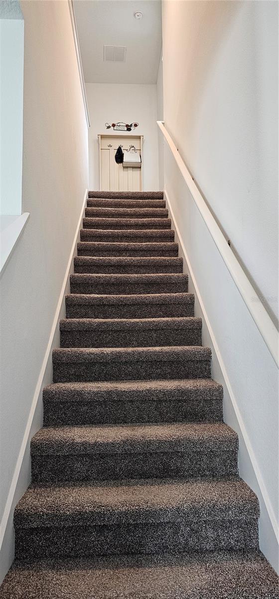 1723 Happiness Row, Kissimmee, FL 34744 - stairway with visible vents