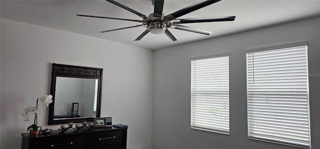 1723 Happiness Row, Kissimmee, FL 34744 - bedroom with a textured ceiling and ceiling fan