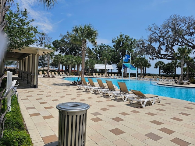 1723 Happiness Row, Kissimmee, FL 34744 - community pool featuring a patio