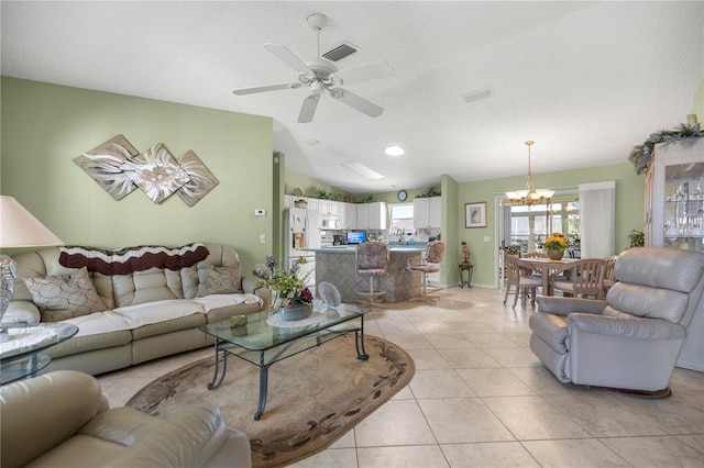 2738 Privada Dr, The Villages, FL 32162 - living room with lofted ceiling, a textured ceiling, light tile patterned flooring, ceiling fan with notable chandelier, and visible vents