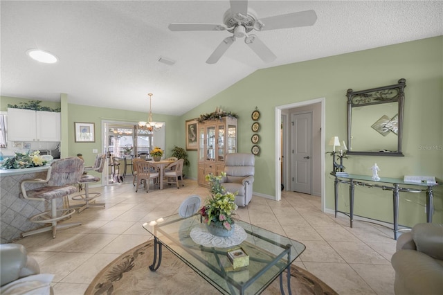 2738 Privada Dr, The Villages, FL 32162 - living room with light tile patterned floors, visible vents, lofted ceiling, a textured ceiling, and ceiling fan with notable chandelier