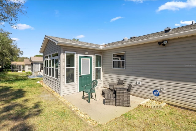 2738 Privada Dr, The Villages, FL 32162 - rear view of property featuring a patio and a lawn