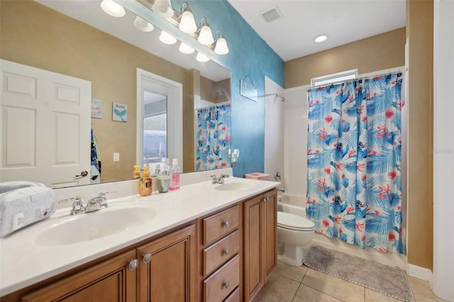 bathroom with double vanity, tile patterned flooring, a sink, and shower / bathtub combination with curtain