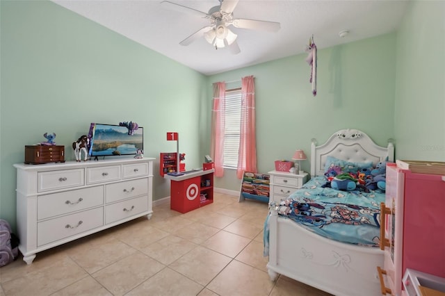 bedroom featuring light tile patterned floors, baseboards, and a ceiling fan