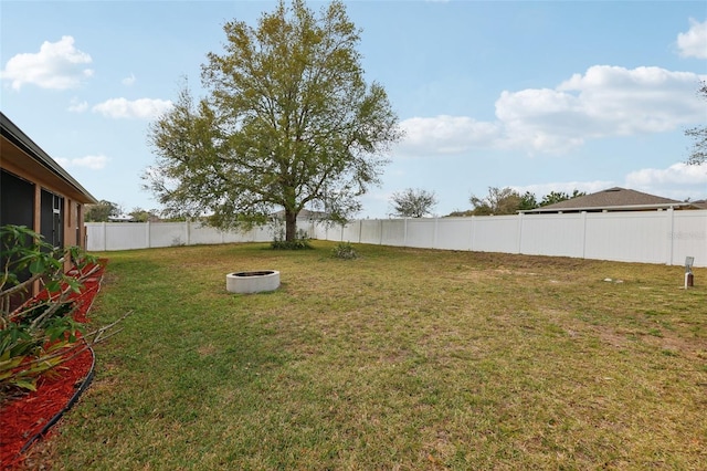 view of yard with a fenced backyard