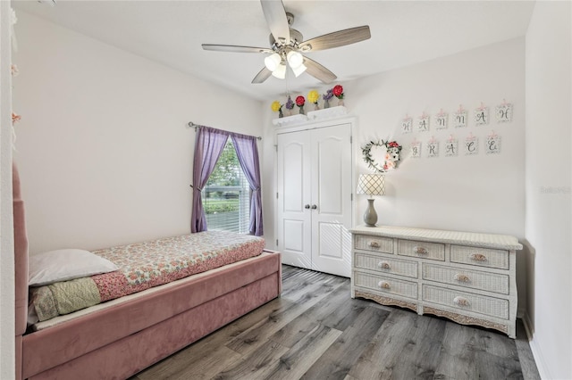 bedroom featuring wood finished floors, a closet, and ceiling fan