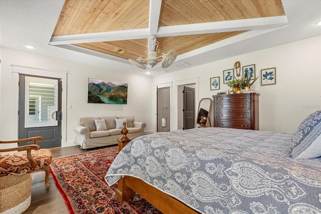 bedroom with wood finished floors, wood ceiling, recessed lighting, and a raised ceiling