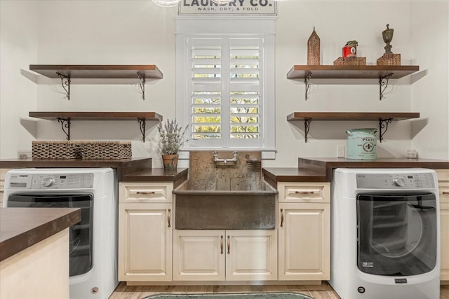 kitchen featuring washer / clothes dryer, open shelves, and dark countertops