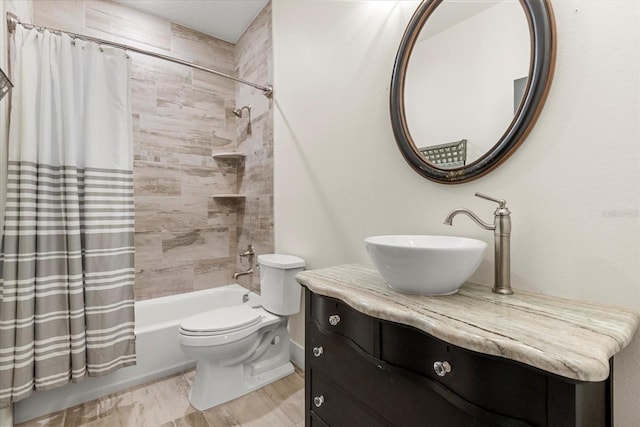bathroom featuring shower / bathtub combination with curtain, toilet, and vanity