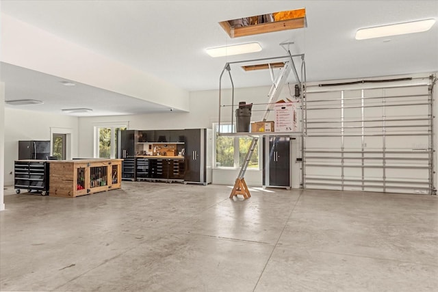 garage with freestanding refrigerator