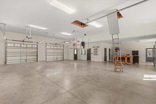 garage featuring a garage door opener