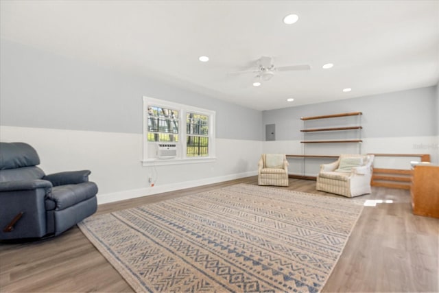 living area featuring recessed lighting, baseboards, ceiling fan, and wood finished floors