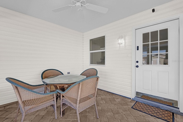 exterior space featuring ceiling fan and a patio area