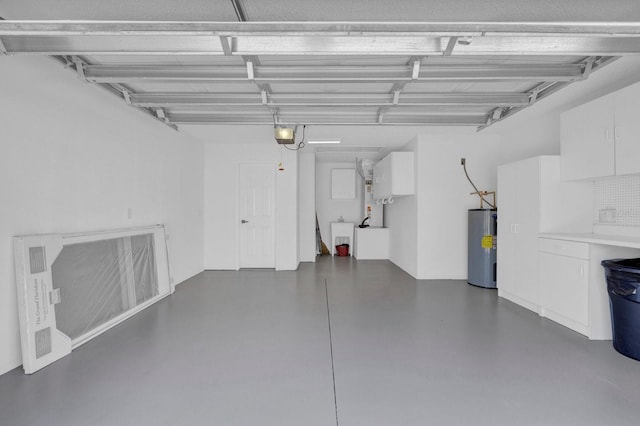 garage with water heater and a garage door opener