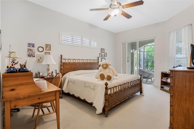 bedroom with light carpet, access to exterior, and ceiling fan