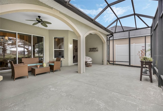 sunroom with ceiling fan and a healthy amount of sunlight