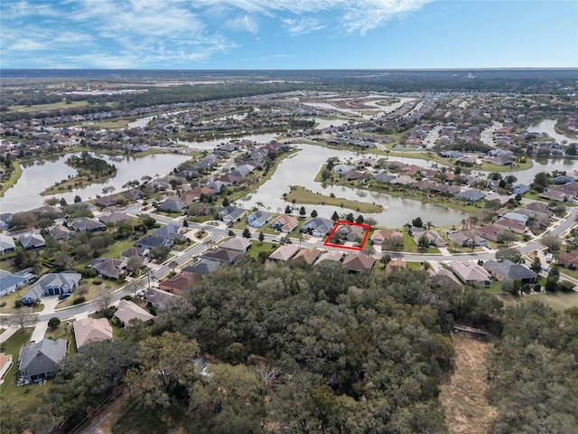 drone / aerial view featuring a residential view and a water view