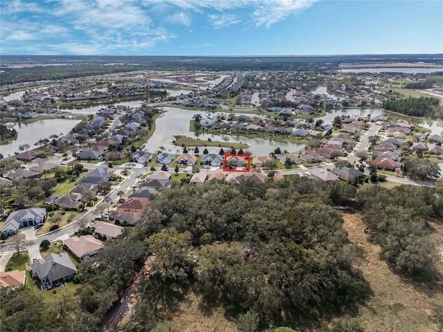 bird's eye view with a water view and a residential view