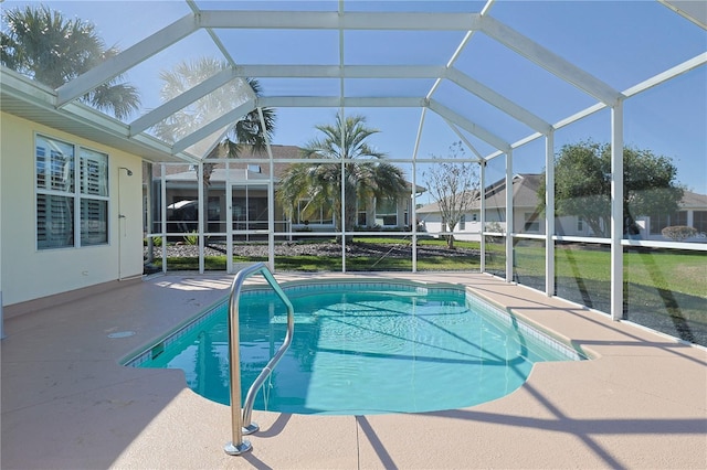 pool featuring a lanai and a patio area