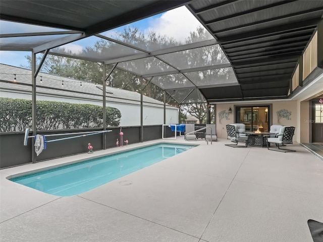 outdoor pool with glass enclosure, an outdoor fire pit, and a patio