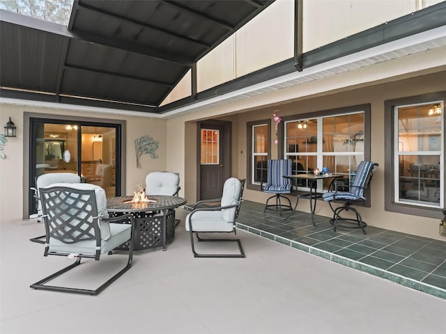 view of patio / terrace with a fire pit