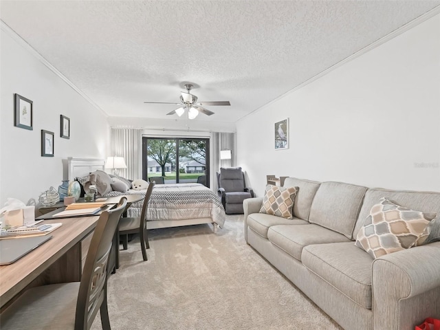 carpeted bedroom with a textured ceiling, a ceiling fan, and crown molding