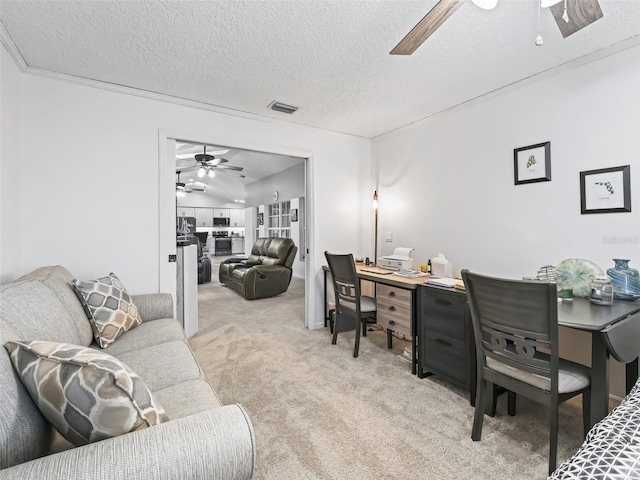 office area featuring light carpet, a textured ceiling, visible vents, and a ceiling fan