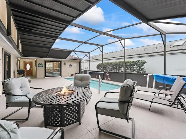 view of patio with an outdoor living space with a fire pit, glass enclosure, and an outdoor pool