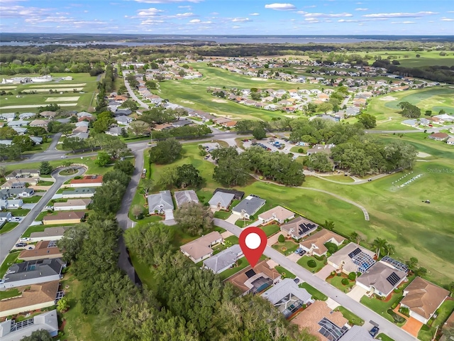 aerial view with view of golf course and a residential view